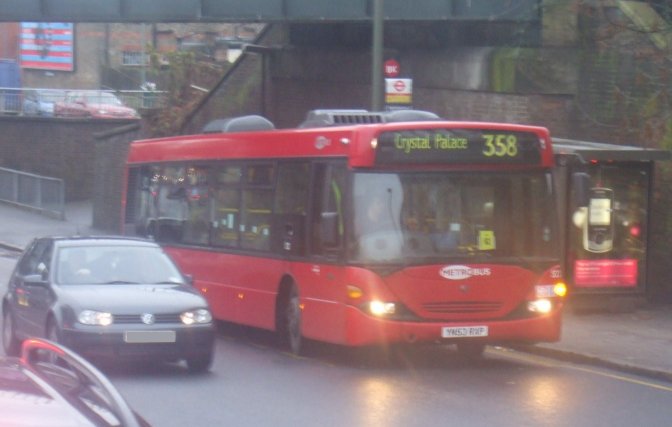 522 passes under railway bridge near Clock House